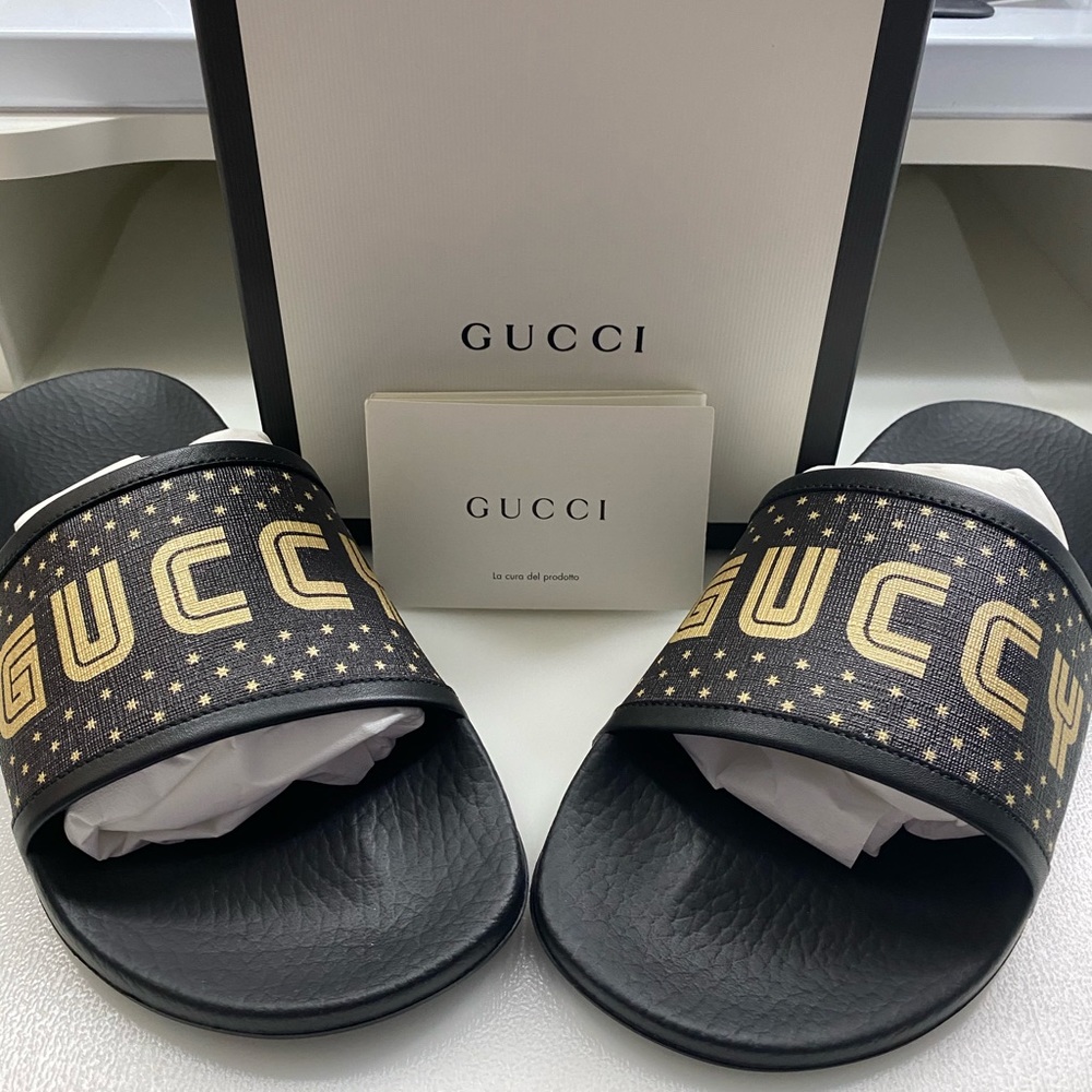 Gucci print canvas and leather slides in SEGA font